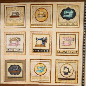 May include: A beige fabric with nine squares, each containing a vintage sewing machine illustration. The sewing machines are in various colors, including pink, blue, green, and black. Each square has a decorative border.