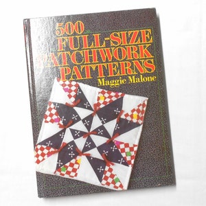 May include: A book titled "500 Full-Size Patchwork Patterns" by Maggie Malone. The cover features a colorful patchwork quilt design with a star pattern.