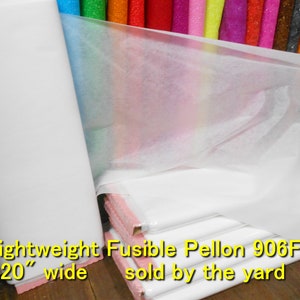 May include: A roll of white fusible Pellon 906F interfacing, 20 inches wide, sold by the yard. The interfacing is lightweight and translucent.