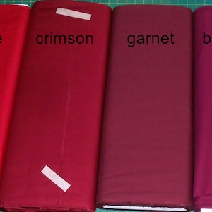 May include: Four fabric swatches in different shades of red, labeled "wine", "crimson", "garnet", and "bordeaux".
