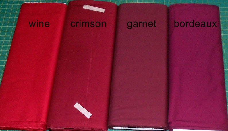 May include: Four fabric swatches in different shades of red, labeled "wine", "crimson", "garnet", and "bordeaux".