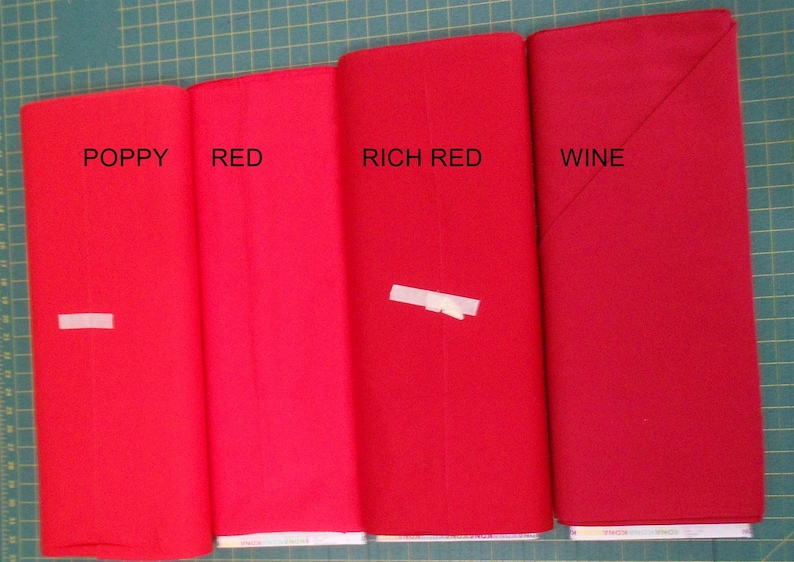 May include: Four fabric swatches in different shades of red, labeled "Poppy", "Red", "Rich Red", and "Wine".