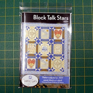 May include: A quilting pattern for a quilt block featuring a star design with a blue and white background. The pattern is called "Block Talk Stars" and features the text "How Great Thou Art" and "Be Thou My Vision".