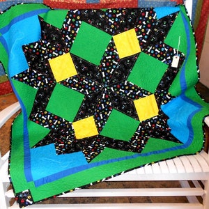Puppy Dogs & Bones Carpenter Star Baby/Toddler/Lap Quilt 55 x 55 green/blue/yellow/multi colored faces and bones, quilted paw print/bone image 1