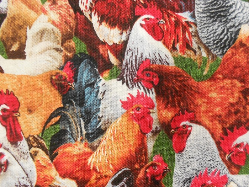 May include: A colourful fabric featuring a close-up pattern of roosters and hens. The fabric features a variety of colours, including red, orange, yellow, brown, white and black.