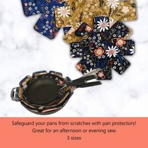 May include: Three floral patterned pan protectors in blue, yellow, and black. The pan protectors are shaped like a star with eight points. The text "Pan Protectors" is at the top of the image.