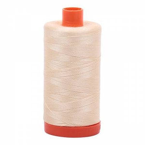 May include: A spool of beige thread with an orange plastic top and bottom.