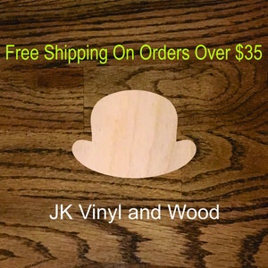 May include: A wooden cutout of a bowler hat on a brown wood background. The text "Free Shipping On Orders Over $35" and "JK Vinyl and Wood" are visible in the image.