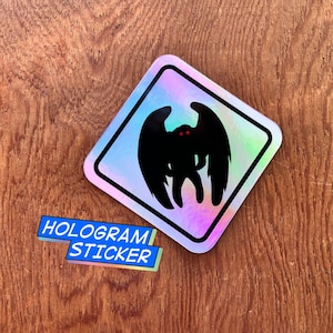 Mothman Crossing Hologram Sticker: Cryptid Warning Sign