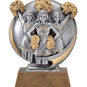 May include: Silver trophy with a gold base featuring three cheerleaders holding pom-poms. The cheerleaders are wearing silver uniforms with gold accents.