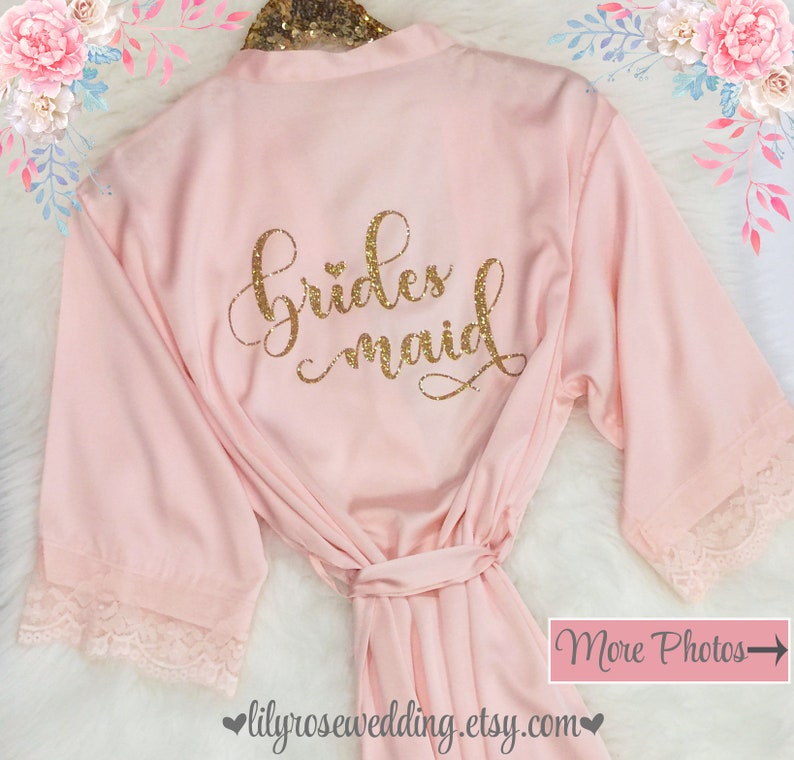 May include: Pink satin robe with lace trim and gold glitter lettering that says "bridesmaid".