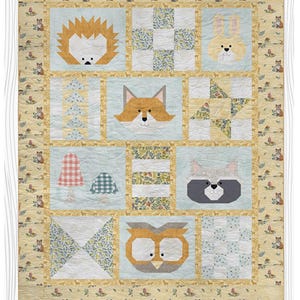 May include: A baby quilt pattern featuring woodland animal designs, including a hedgehog, fox, rabbit, raccoon, and owl. The quilt is 42 x 53 inches and has a light blue, yellow, and white color scheme. The text "Into the Woods" and "Pieced Baby Quilt Pattern" are visible.