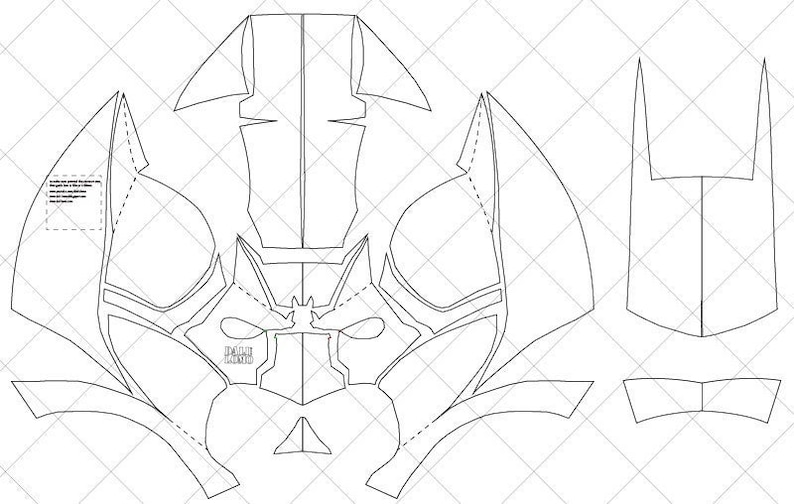 May include: A printable template for a papercraft mask. The mask is designed to look like a superhero with a large, pointed head and a detailed face.