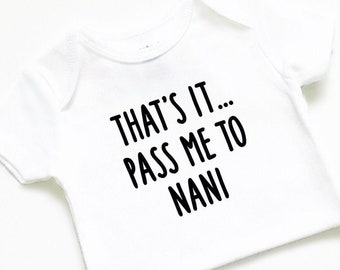 May include: White baby onesie with black text that reads "That's it... Pass me to Nani."