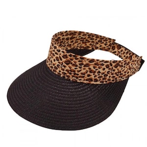 May include: A black visor with a leopard print band. The visor is made of a woven straw material.