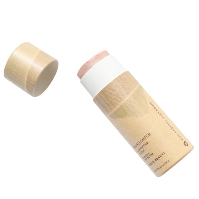 Eco-friendly cream highlighter stick with removable cap, showing zero-waste sustainable beauty packaging design.