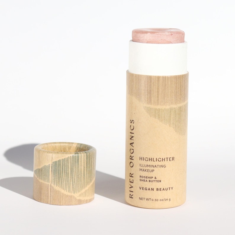 Organic Rose Quartz cream highlighter in sustainable bamboo packaging with vegan ingredients, featuring rosehip and shea butter for natural luminous glow.