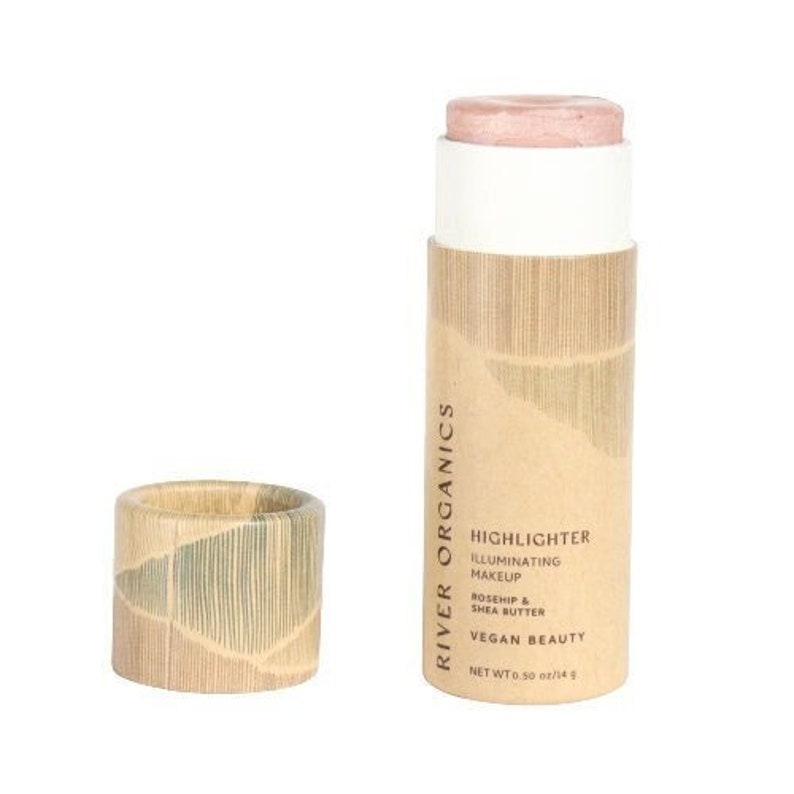 Clean beauty highlighter set featuring sustainable packaging and rose quartz illuminating makeup stick for natural glow.