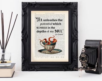 May include: A black framed print with a vintage book page background featuring an illustration of a teacup with an octopus inside. The text on the page reads "TEA unleashes the potential which slumbers in the depths of my SOUL" - Leo Tolstoy.