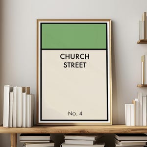 May include: Framed wall art featuring a green and cream design with the words "CHURCH STREET" in black text. The number "No. 4" is printed below the text. The artwork is in a gold frame.