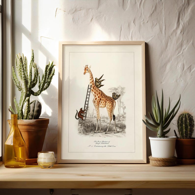 May include: A framed vintage print featuring a giraffe with monkeys climbing a ladder. The giraffe has brown spots on a tan body. The print is in a light wood frame and is displayed near potted plants.