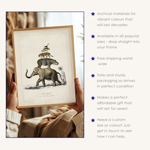 May include: A framed print featuring a vintage illustration of an elephant, hippopotamus, leopard, and monkey stacked on top of each other. The artwork is in a wooden frame and held by hands.
