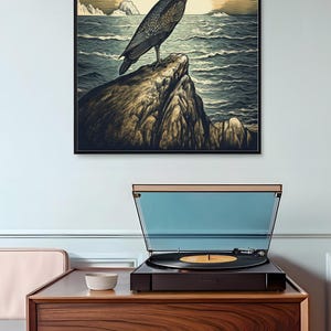 May include: A vintage-style illustration of a bird perched on a rock overlooking a body of water. The bird is dark blue and gray with a long beak. The background is a sunset with a sunburst effect.