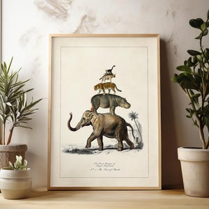 May include: Framed vintage-style print featuring an elephant, hippo, leopard, and other animals stacked on top of each other. The artwork has a beige background and is framed in a light wood. The print is displayed near potted plants.
