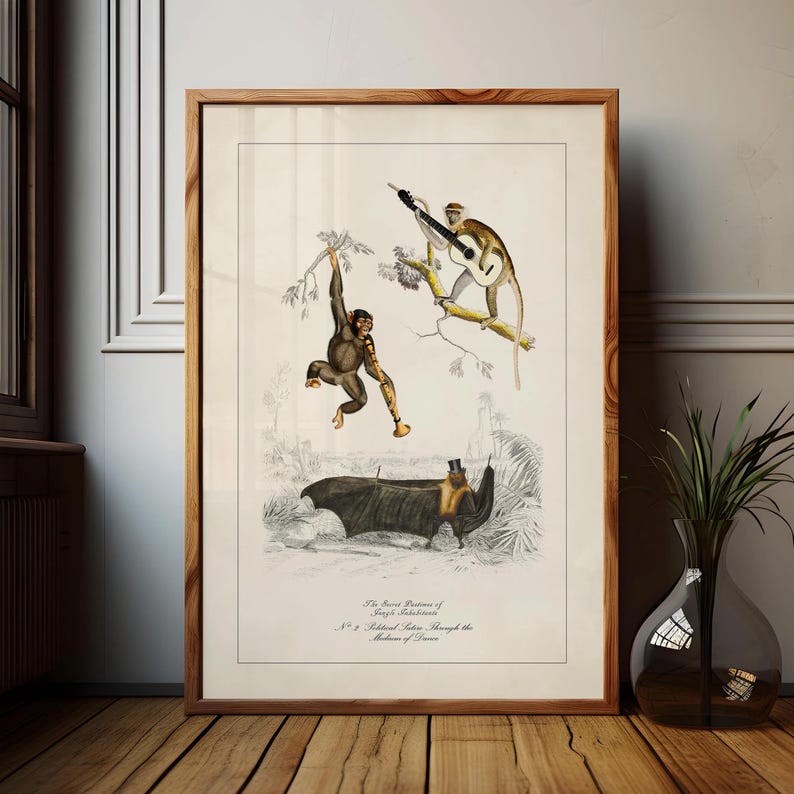 May include: A framed vintage print featuring illustrations of monkeys and a bat. One monkey plays a guitar, another swings from a branch. The bat wears a top hat. The print has text at the bottom.