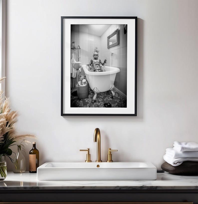 May include: A black and white photograph of a robot taking a bath in a white bathtub with four legs. The robot is wearing a white hat and has a silver body. The bathroom is tiled with white and gray tiles.