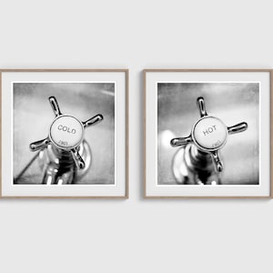May include: Two framed black and white prints. One print shows a close-up of a faucet handle labeled "COLD" with the number "1901". The other print shows a faucet handle labeled "HOT" with the number "1901".
