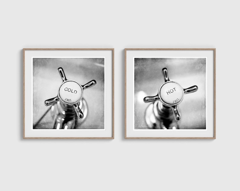 May include: Two framed black and white prints. One print shows a close-up of a faucet handle labeled "COLD" with the number "1901". The other print shows a faucet handle labeled "HOT" with the number "1901".