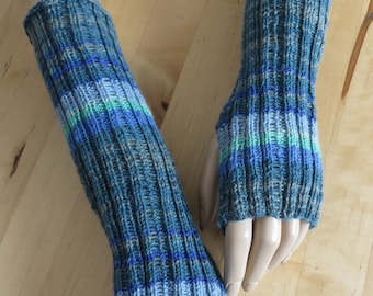 Blue colorful wrist warmers with thumb holes made from Regia sock yarn