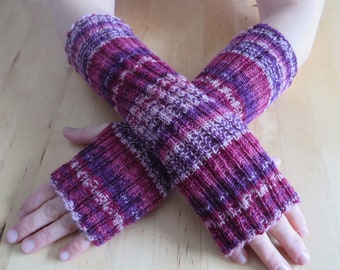 Colorful hand-knitted wrist warmers made of sock wool with a thumb hole