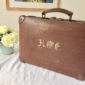 Vintage brown leather suitcase.