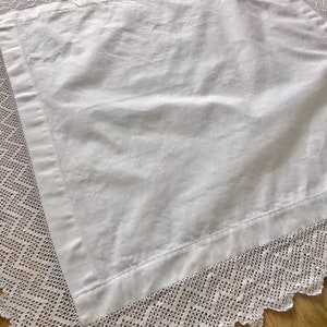Vintage cotton crochet edged decorative tablecloth.