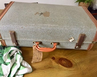 Vintage brown suitcase.