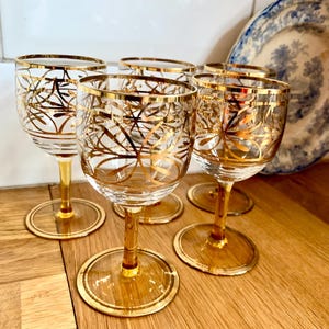 Retro Set of 5 gold sherry glasses.