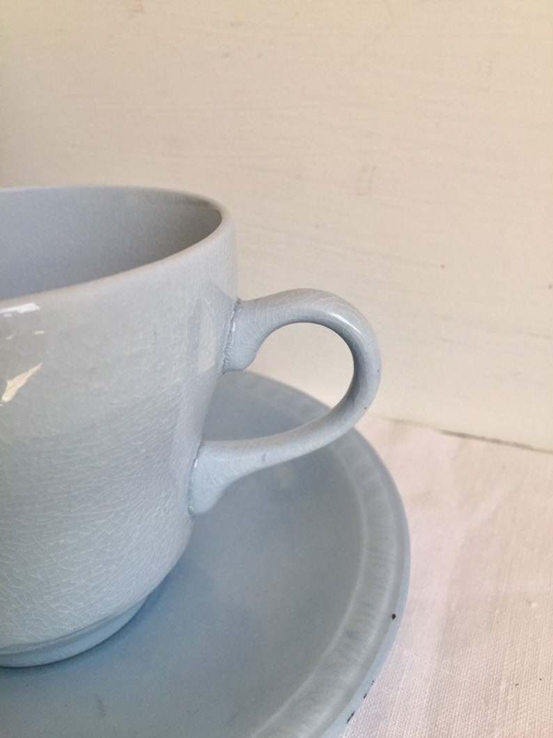 vintage pastel ware tea cup and saucer Utilitarian ware.