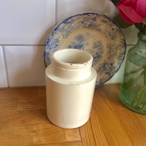 Antique and vintage stoneware utensil pot or vintage vase. Manufactured late 1800&#39;s.