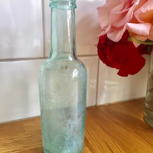 Antique clear glass bottle.