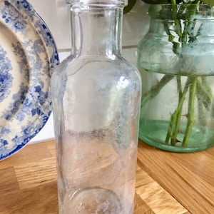 Antique clear glass bottle.
