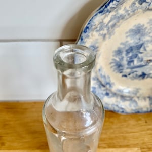 Antique clear glass bottle.