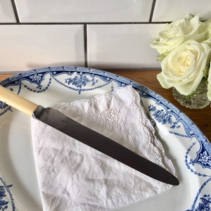 Fine vintage bread or carving knife with resin handle.
