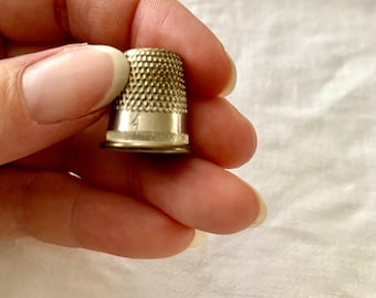 Vintage metal thimble. Size 4