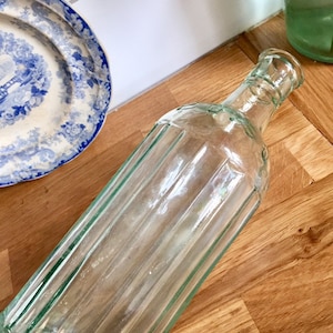 Antique clear glass poison bottle.
