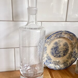 Gorgeous vintage clear glass mid century decanter.