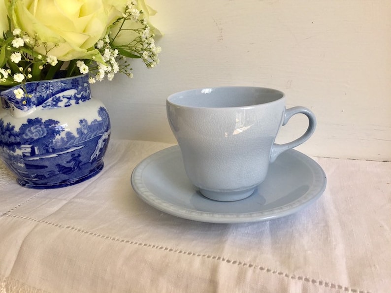 vintage pastel ware tea cup and saucer Utilitarian ware.
