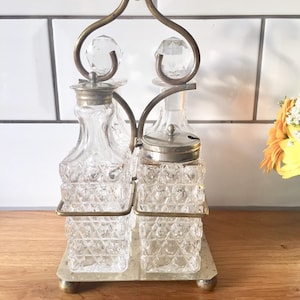 Antique Victorian 4 bottle creut set with silver stand. Oil and vinegar bottles. Salt and pepper shakers.