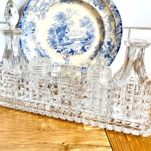 Vintage 5 bottle creut set with glass stand. Oil and vinegar bottles. Salt and pepper shakers.